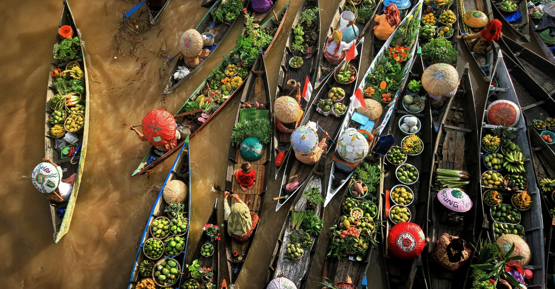 Lok Baintan floating market Petchaburi Thailand traditional boats tropical fruits