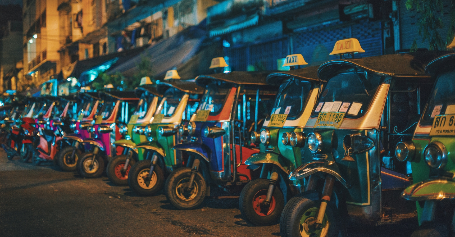 Tuk tuk samlor taxi traditional Thailand local transport Bangkok busy streets